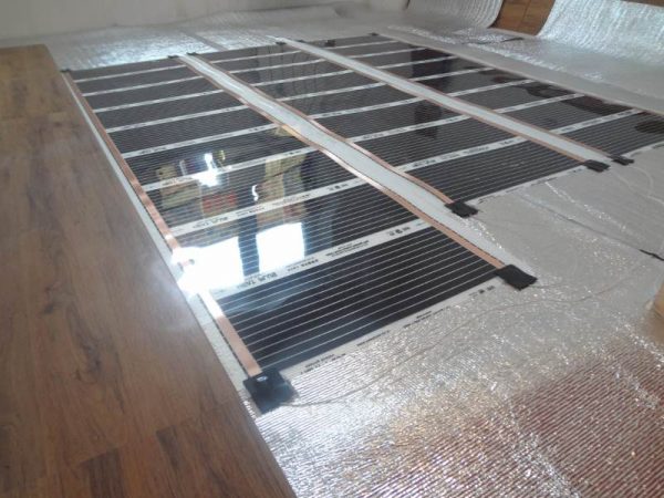 Установка пленочного инфракрасного пола под ламинат от компании «IN-HEAT»