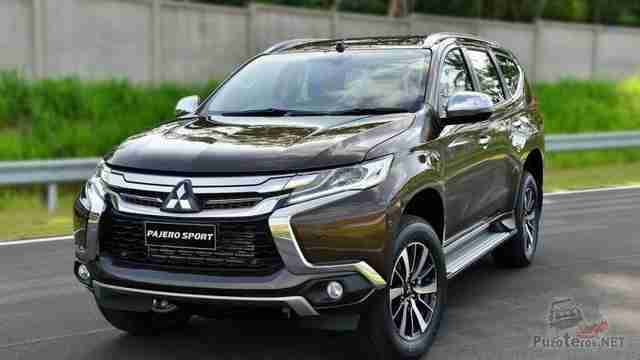 Коричневый Mitsubishi Pajero Sport на дороге