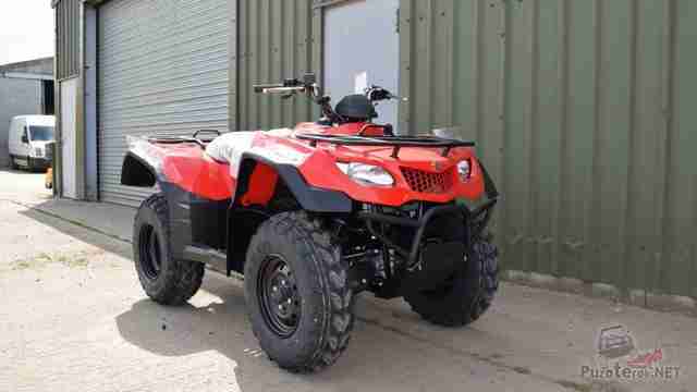 Красный Сузуки KINGQUAD возле гаража