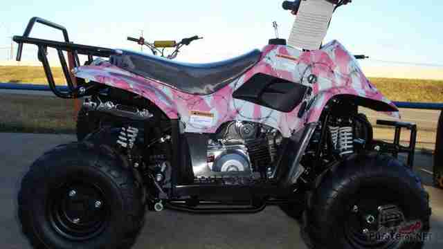 Розовый Stels ATV 110 СС у ограждения